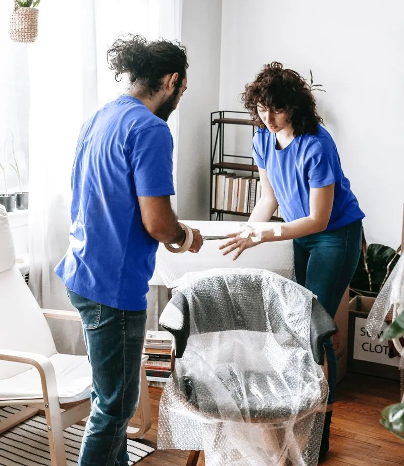 Packing team preparing household belongings for a move