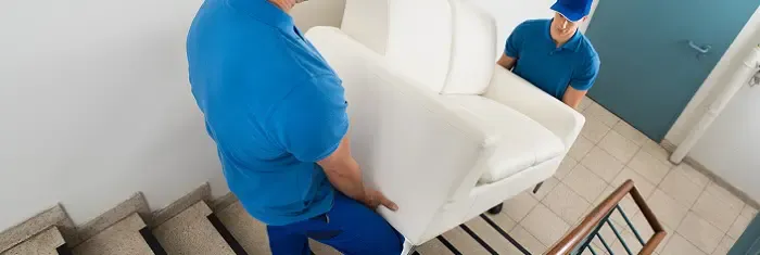 Furniture carried on apartment stairs without a lift